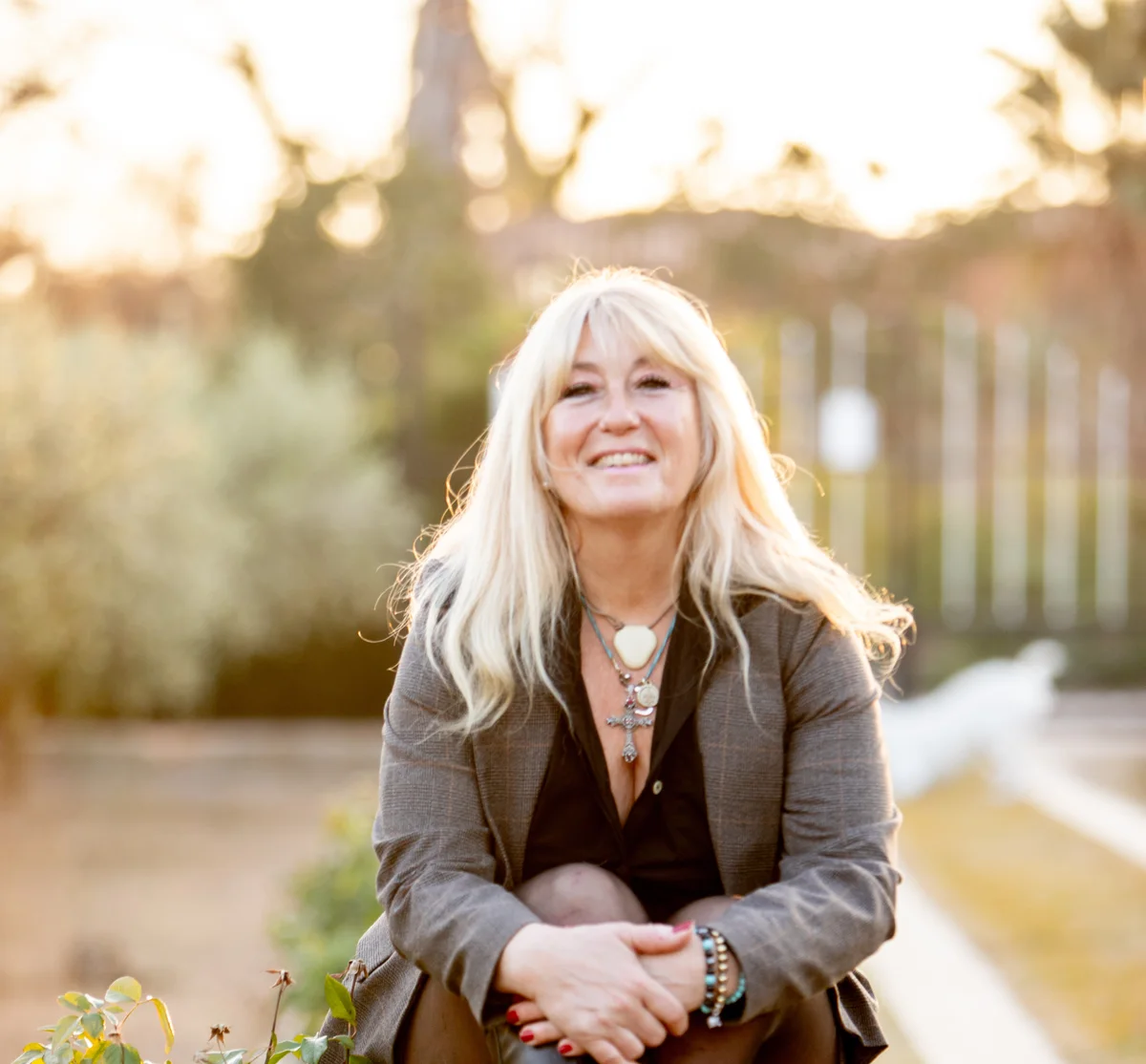 Rachel Paling smiling in a sunlit garden